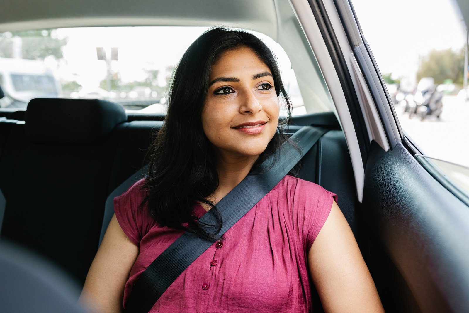 Happy young adult indian woman traveling by car Home happy young adult indian woman traveling by car